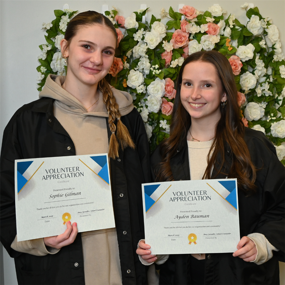  Picture of Sophie and Ayden holding their certificates.